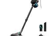 a black and blue vacuum cleaner with a brush on top of it