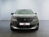 the front view of a grey car in a showroom