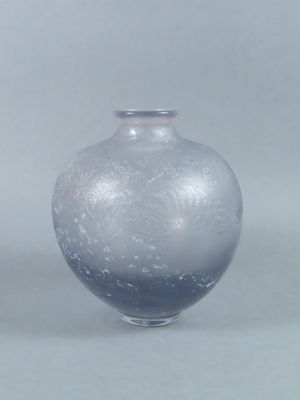 two vases sitting next to each other on a table