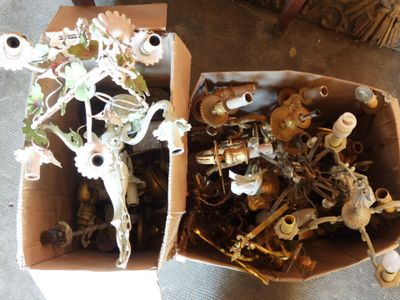 two boxes full of assorted items sitting on the floor