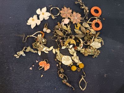 a bunch of jewelry that is laying on a table
