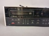the radio is sitting on top of a table with a remote