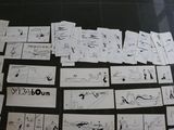 a lot of drawings on the floor of this room