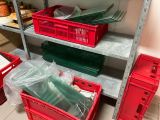 many plastic containers on the shelves in the room