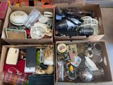 two boxes with various items in them on the floor