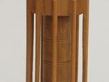 a small wooden object that is on a white surface