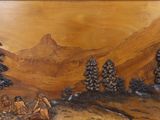 a picture of a wood carving of a group of people in the woods