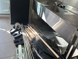 an image of a kitchen with a sink and a lot of tools