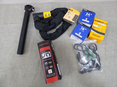 the contents of a tripod and other items are laid out on the floor