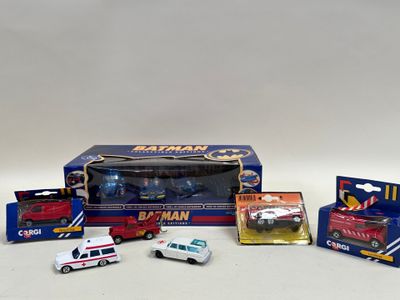 a box of assorted toy vehicles and a box of other toy vehicles