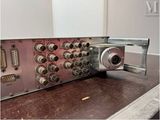 a close up of a metal device on a wooden table