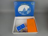 a box with a card game inside of it on a table