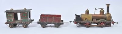 trois petits trains assis l'un à côté de l'autre sur une surface blanche