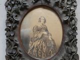 a picture of a woman in a dress in a picture frame