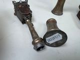 two antique bells and a bell bell on a table