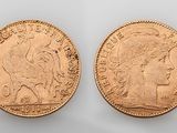 two gold sovereigns, one of which has a head of a woman and the other of which is a