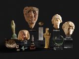 many pieces of art on display on a black surface