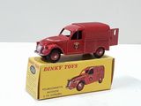 a red toy truck sitting on top of a yellow box