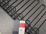 a metal rack with a lot of wires attached to it