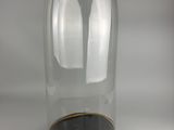 a glass clochet with a wooden base on a white surface