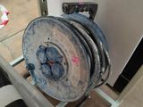 a picture of a reel on a cart in a room