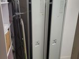 two lockers in the corner of a room next to a closet