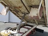 an image of a dump truck that is parked in a lot