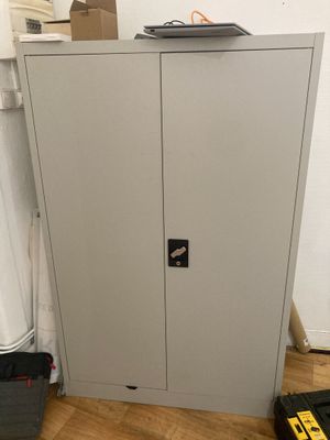 an image of a metal cabinet in the corner of a room