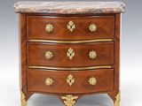 an antique chest of drawers with marble top