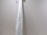 a towel hanging on a clothes line in a room