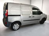 a silver van that is parked in a garage