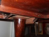a wooden table with a drawer underneath it