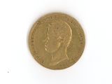 une vieille pièce d'or sur laquelle figure le portrait d'un homme