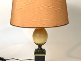 a lamp that is sitting on a table with a lamp on it