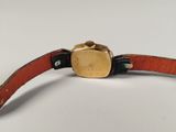 an image of a wrist watch with a leather band and a gold buckle