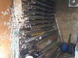 a pile of wood in a garage next to a window