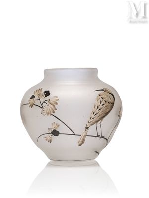 a white vase with a bird on it on a white surface