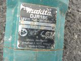 a close up of a green machine with a label on it
