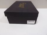 the box is black with gold writing on the lid