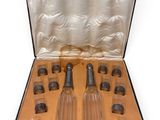a case that has a set of glass bottles inside of it