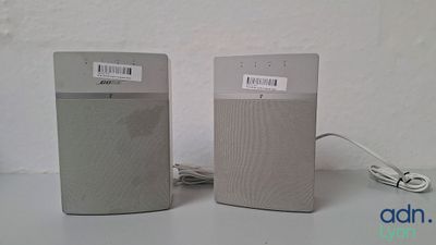 two speakers sitting next to each other on a table