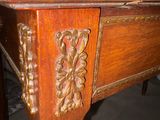 a wooden table with a carved design on top of it
