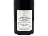 a bottle of wine that is sitting on a table