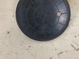 a yellow and black object on the floor next to a black object