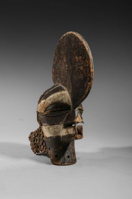an image of a wooden sculpture of a man ' s head