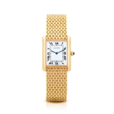 une montre-bracelet pour femme en or jaune, avec des chiffres romains et des chiffres romains