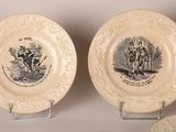three plates with a picture of a man riding a horse and a woman riding a horse