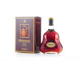 the bottle of henness xo is next to the box