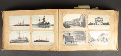 a book with pictures of ships on it on a table