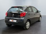 a small car that is parked in a room